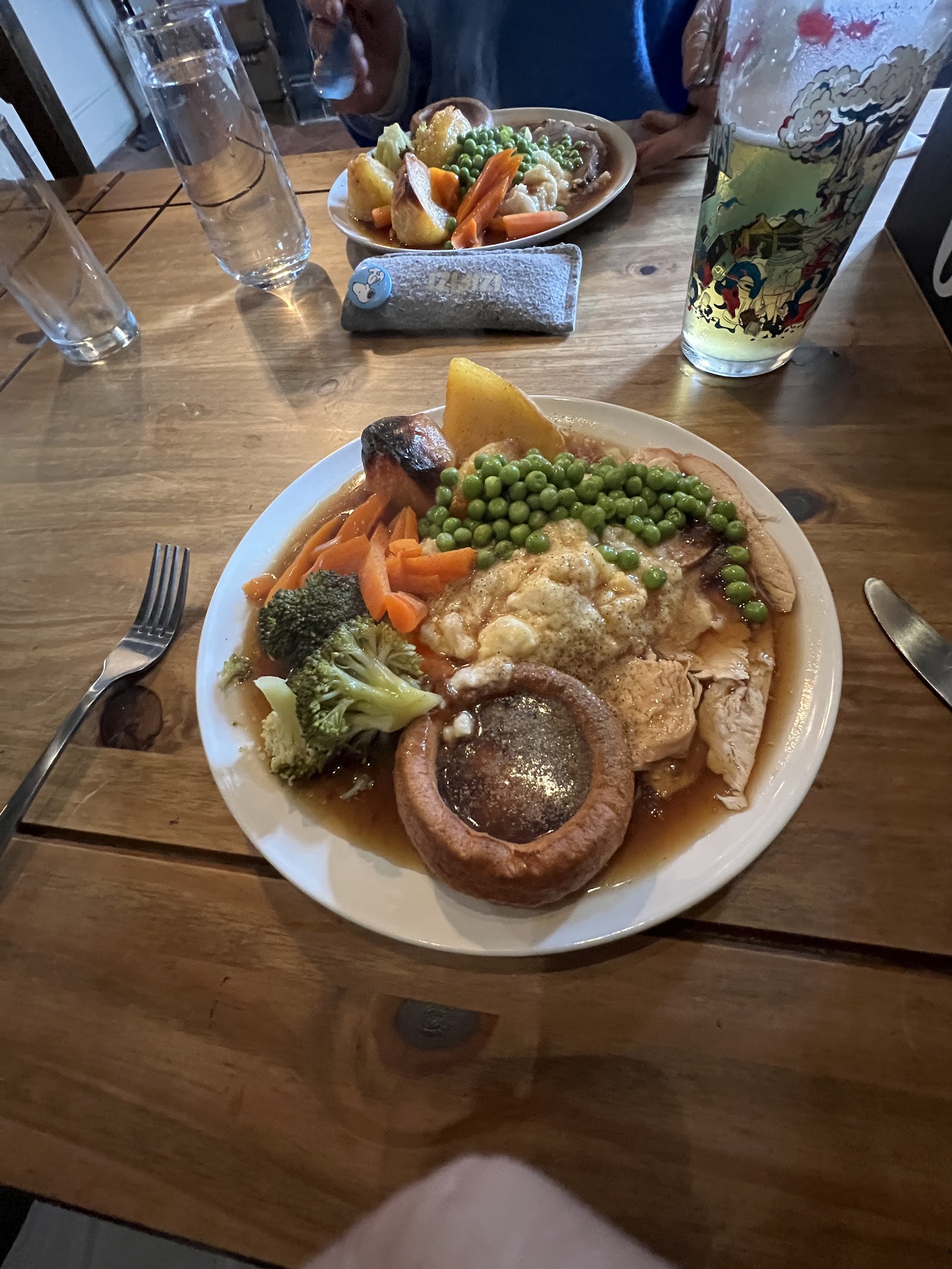 A homely roast dinner on a wooden pub table